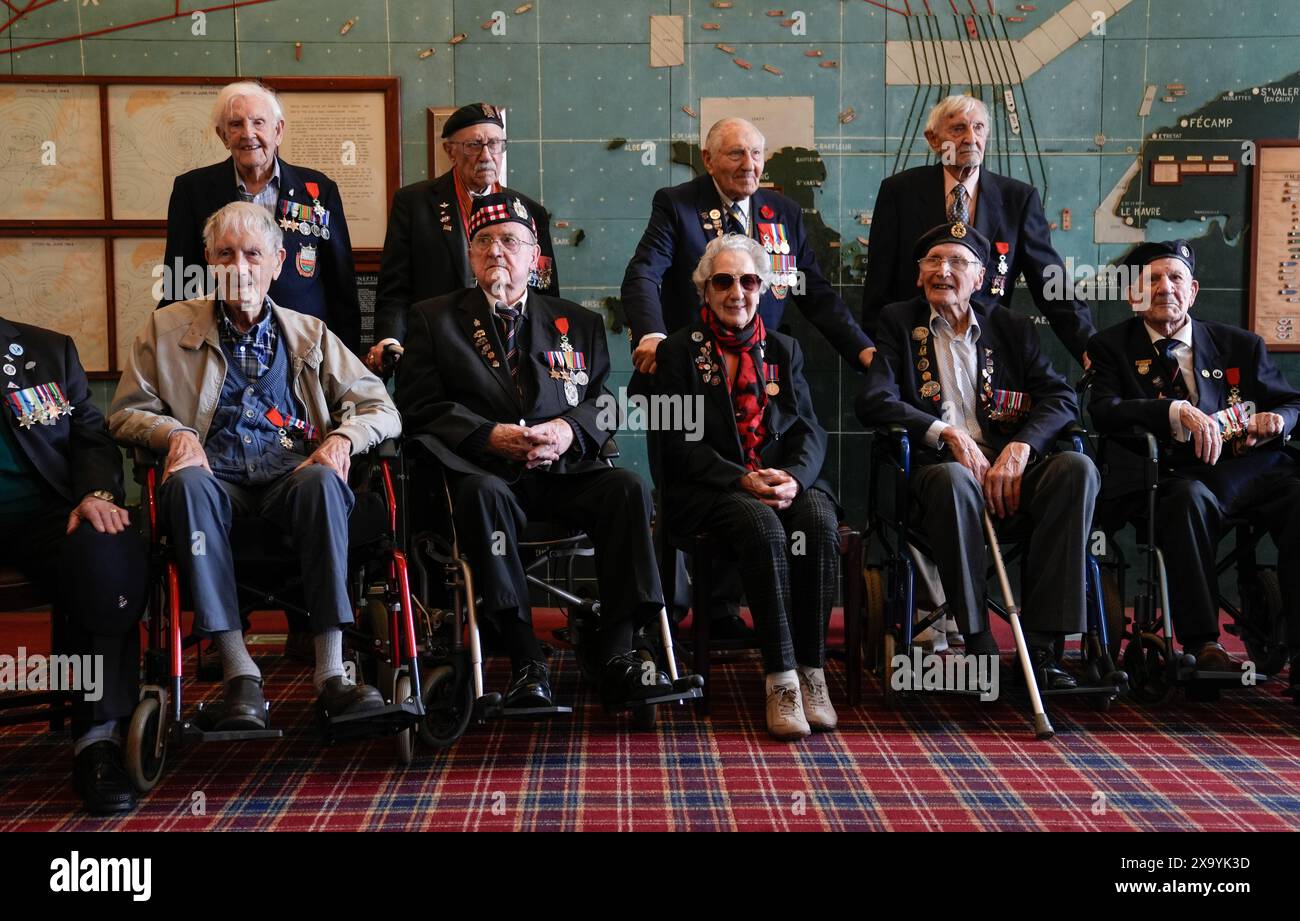 Normandy veterans pose for a photograph in the Map room at Southwick