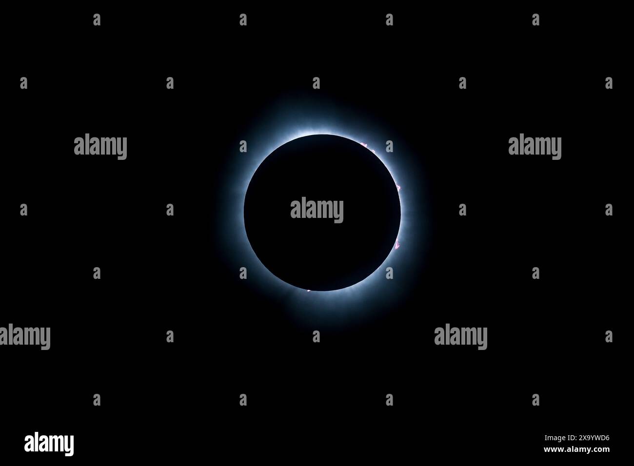 A solar eclipse featuring a diamond ring effect and baileys beads Stock Photo