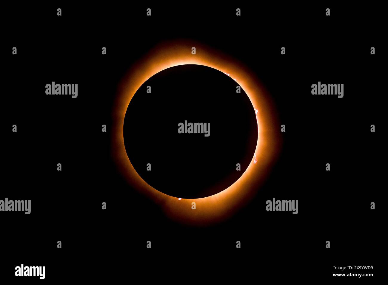 A solar eclipse featuring a diamond ring effect and baileys beads Stock Photo