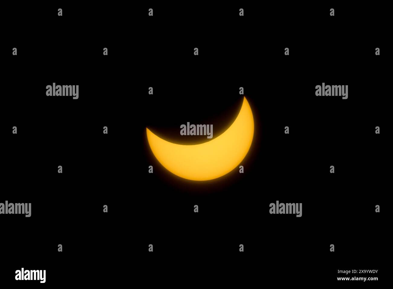 A solar eclipse featuring a diamond ring effect and baileys beads Stock Photo