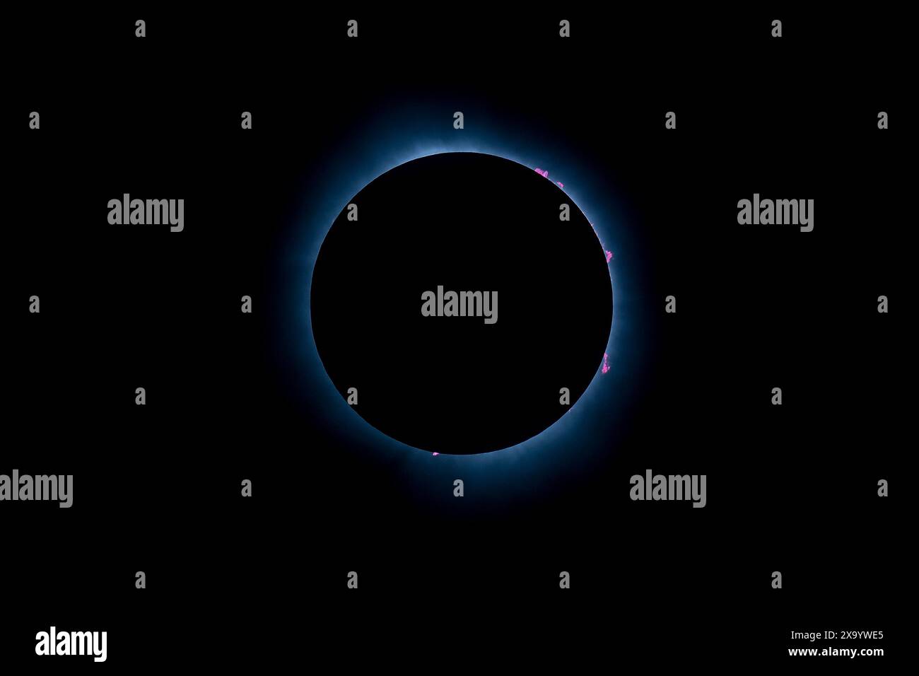 A solar eclipse featuring a diamond ring effect and baileys beads Stock Photo