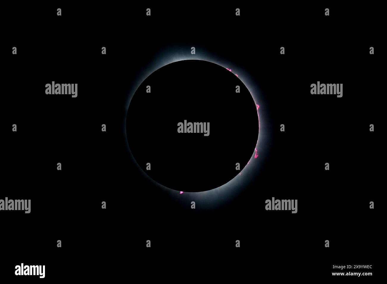 A solar eclipse featuring a diamond ring effect and baileys beads Stock Photo