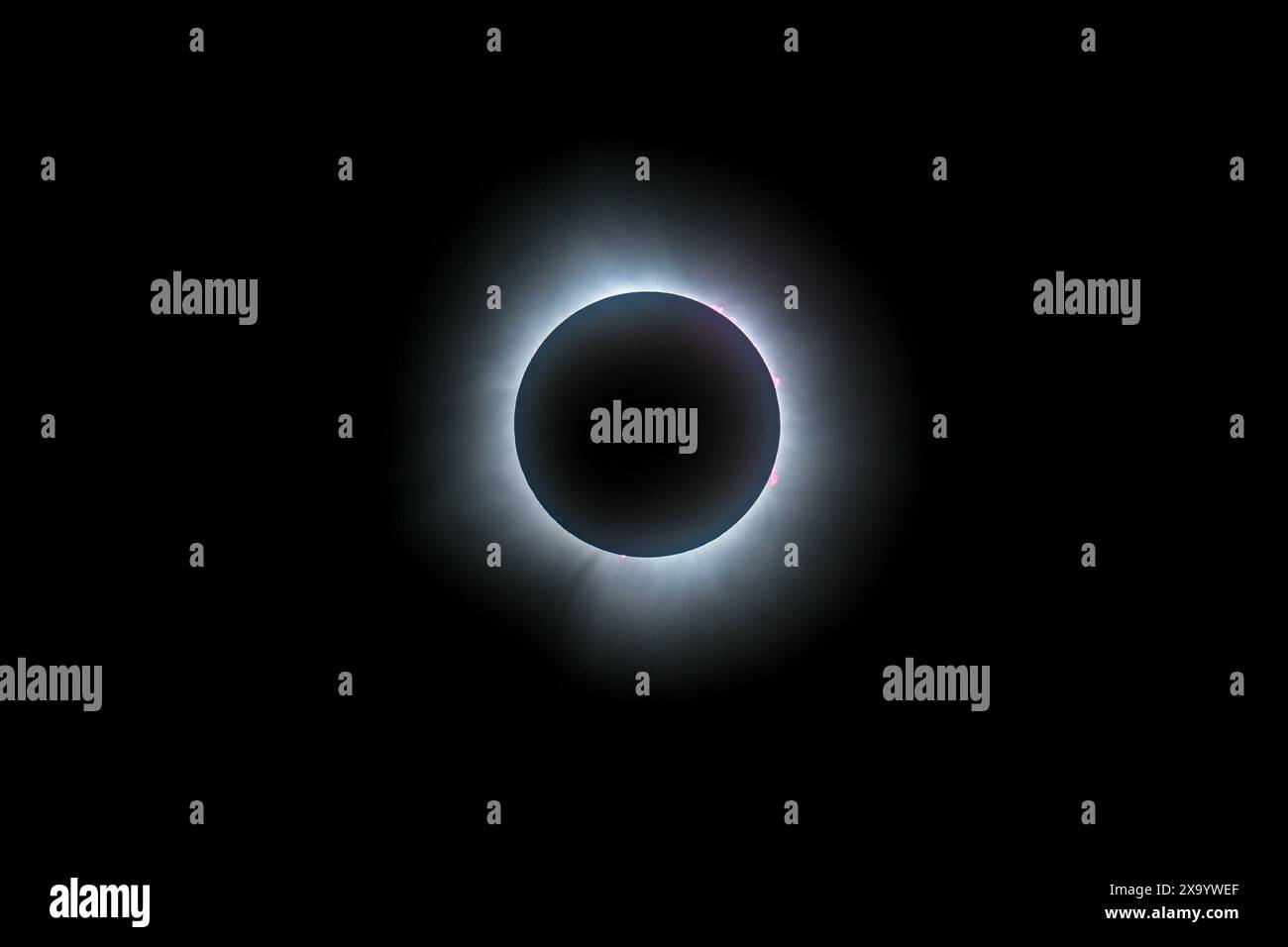 A solar eclipse featuring a diamond ring effect and baileys beads Stock Photo