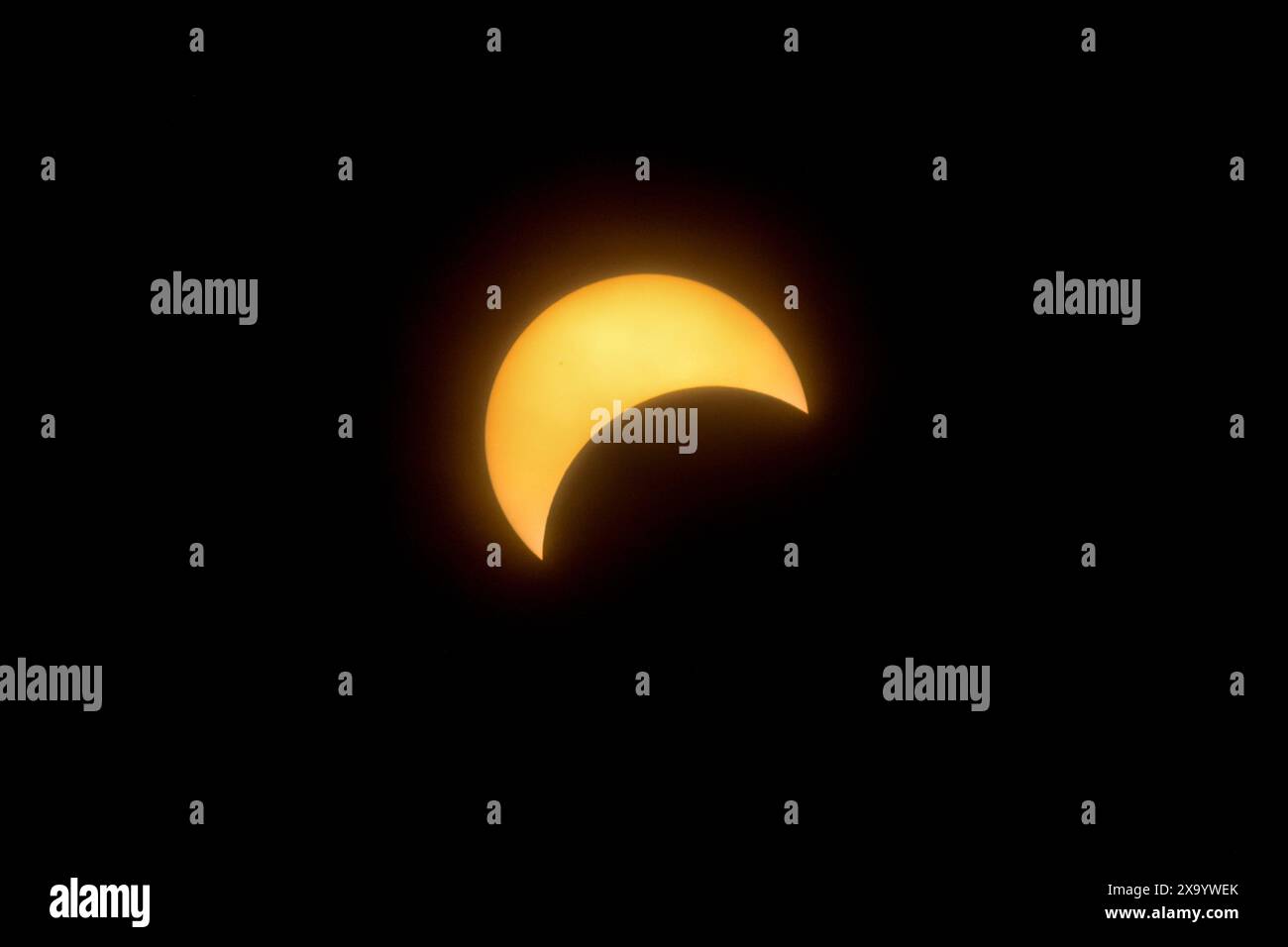 A solar eclipse featuring a diamond ring effect and baileys beads Stock Photo