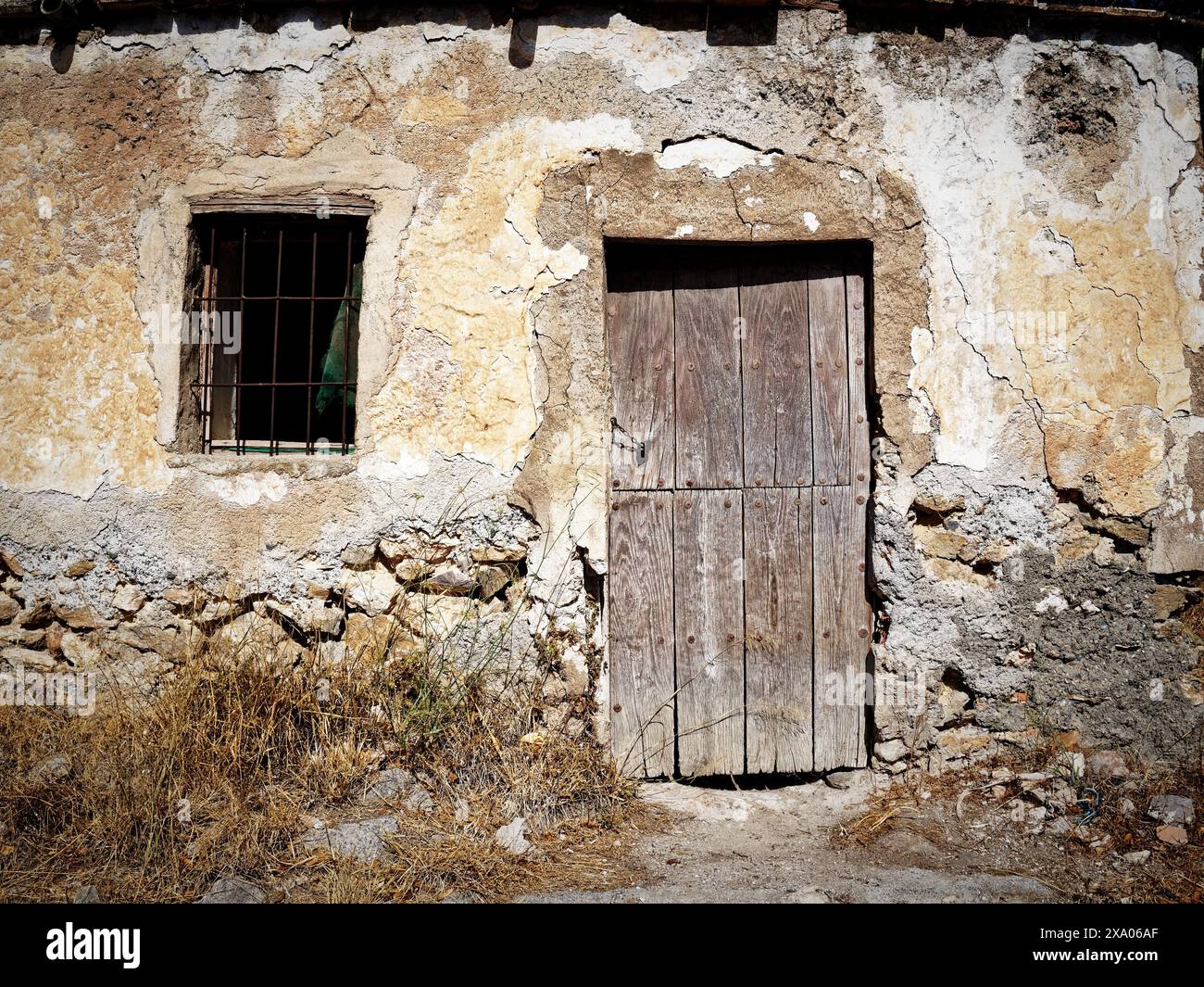 An old rural house with a door and window Stock Photo - Alamy