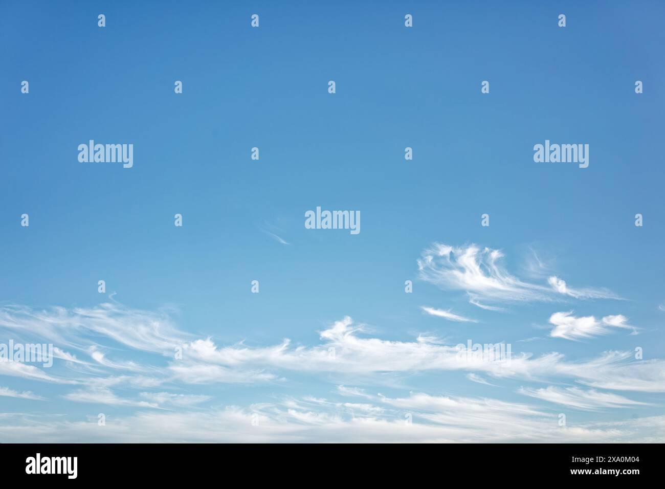 A clear blue sky with fluffy white clouds. Stock Photo