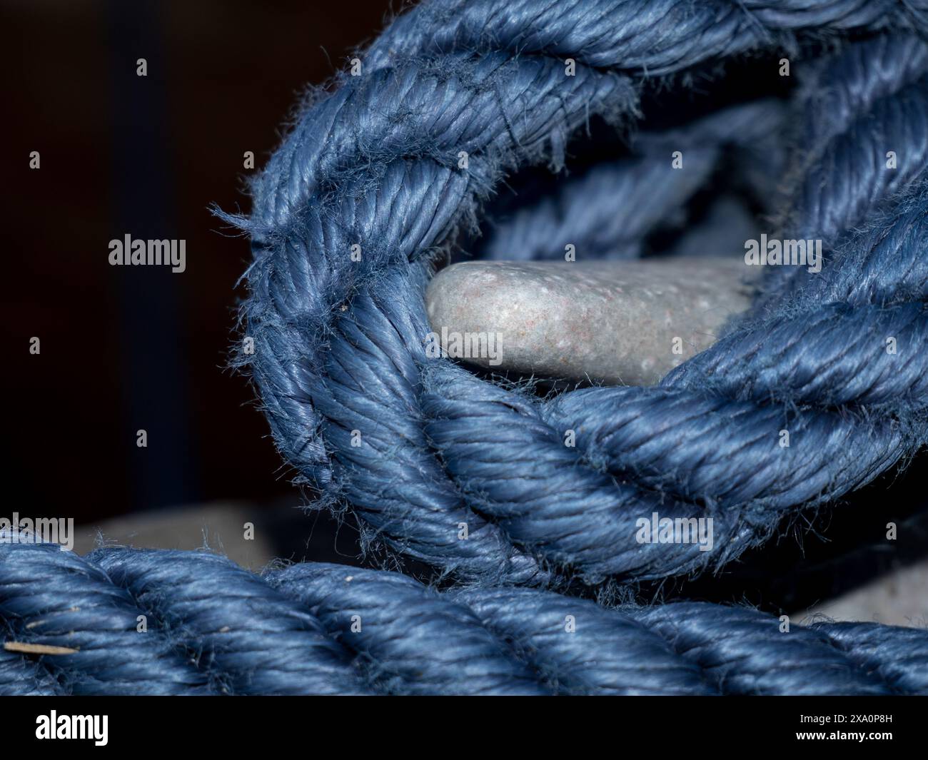 Wooden piece tied with rope and wire Stock Photo