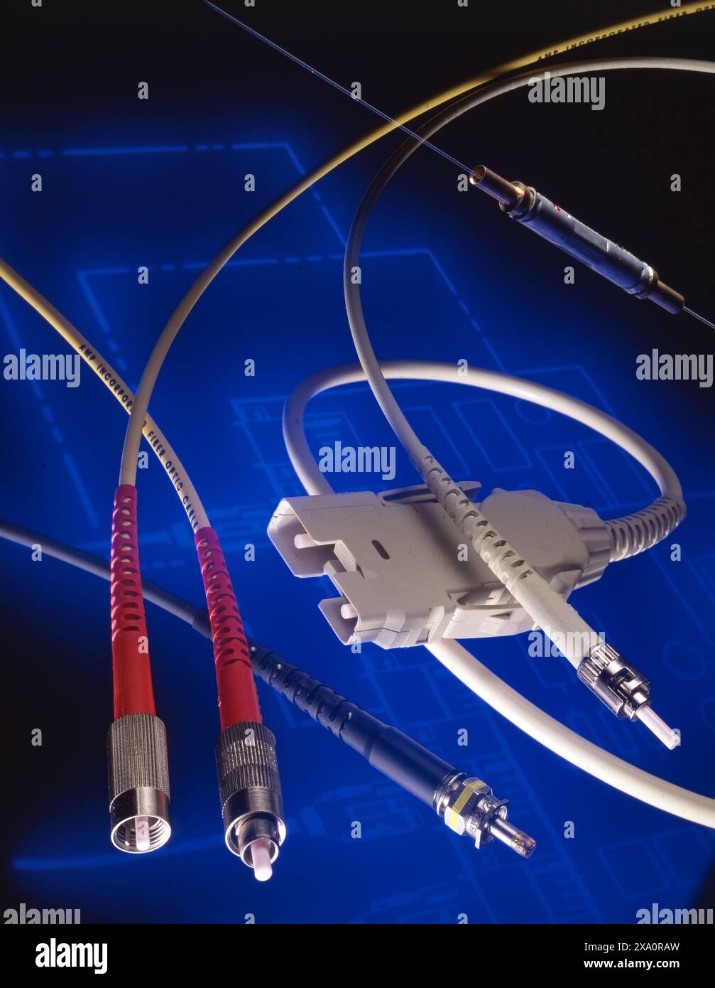 Fiber optic and data cables with connectors on blue tech background ...