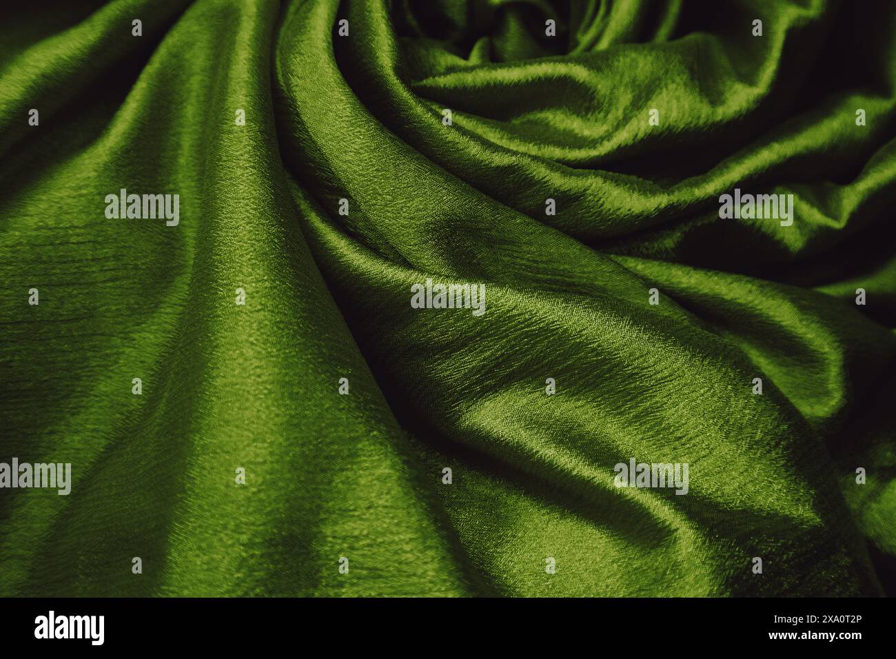 A green silk fabric background Stock Photo