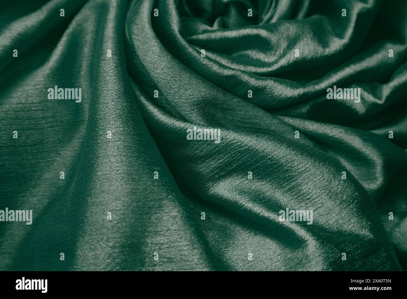 A green silk fabric background Stock Photo