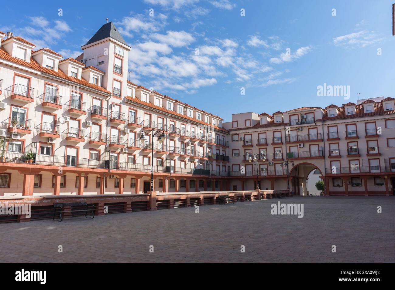 The main square and town hall of Alcazar de San Juan bask under a summer day's bright blue sky. Stock Photo