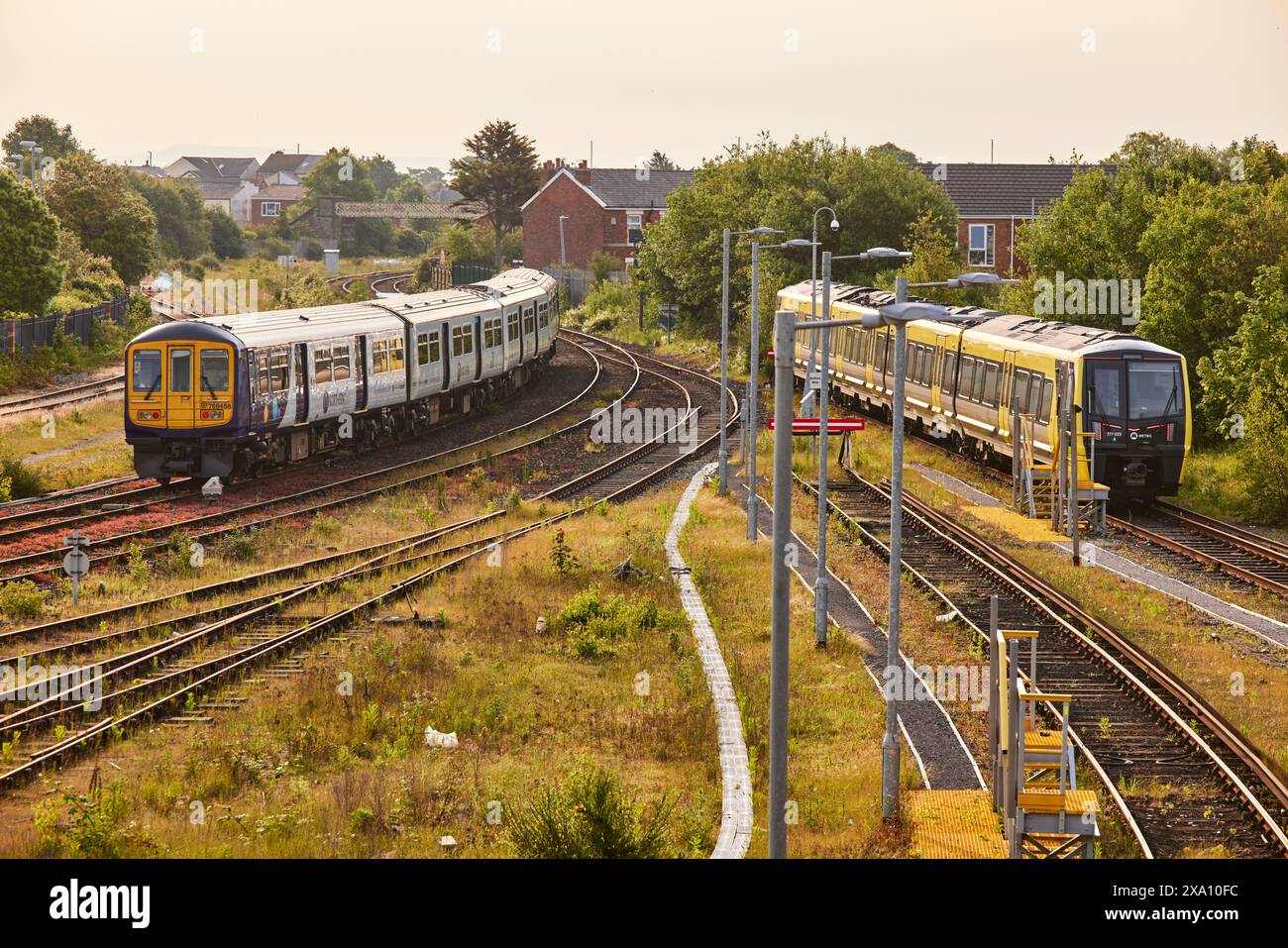 Southport, Sefton, Merseyside. Merseryrail trains at the station as a Northern train departs for Manchester Stock Photo