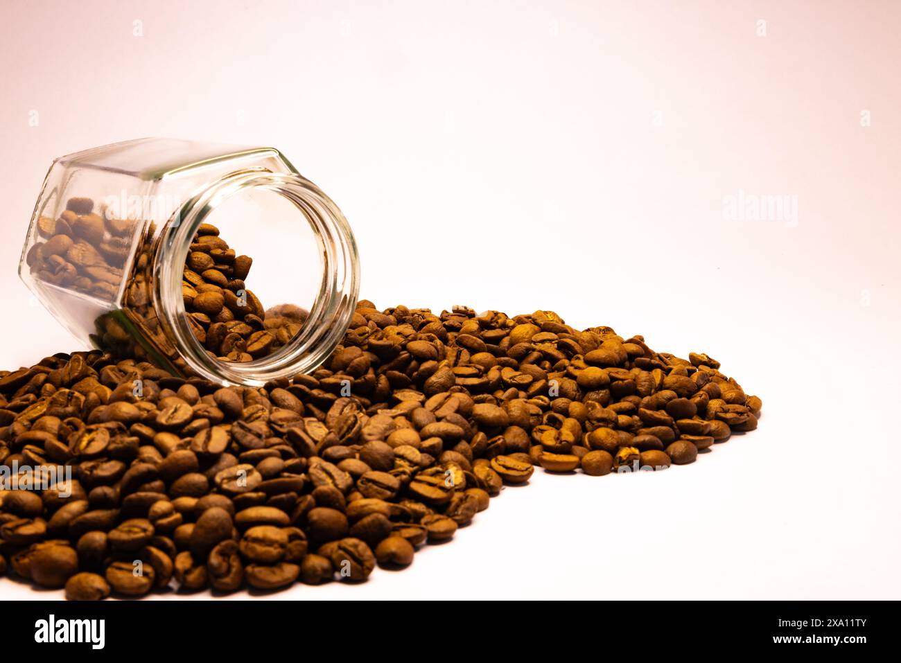 The coffee beans displayed on a plain white background. Stock Photo