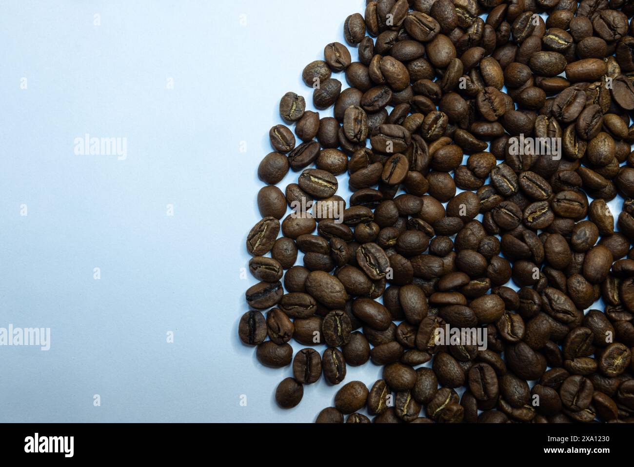 The coffee beans displayed on a plain white background. Stock Photo