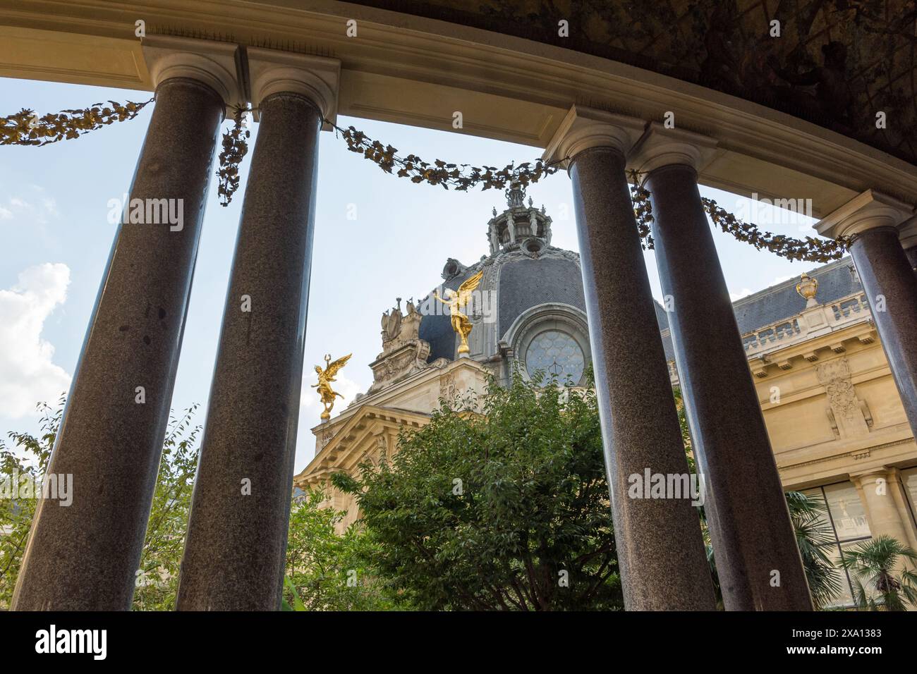 A view through pillars to the Garden of Petit Palais, Paris, France. Stock Photo