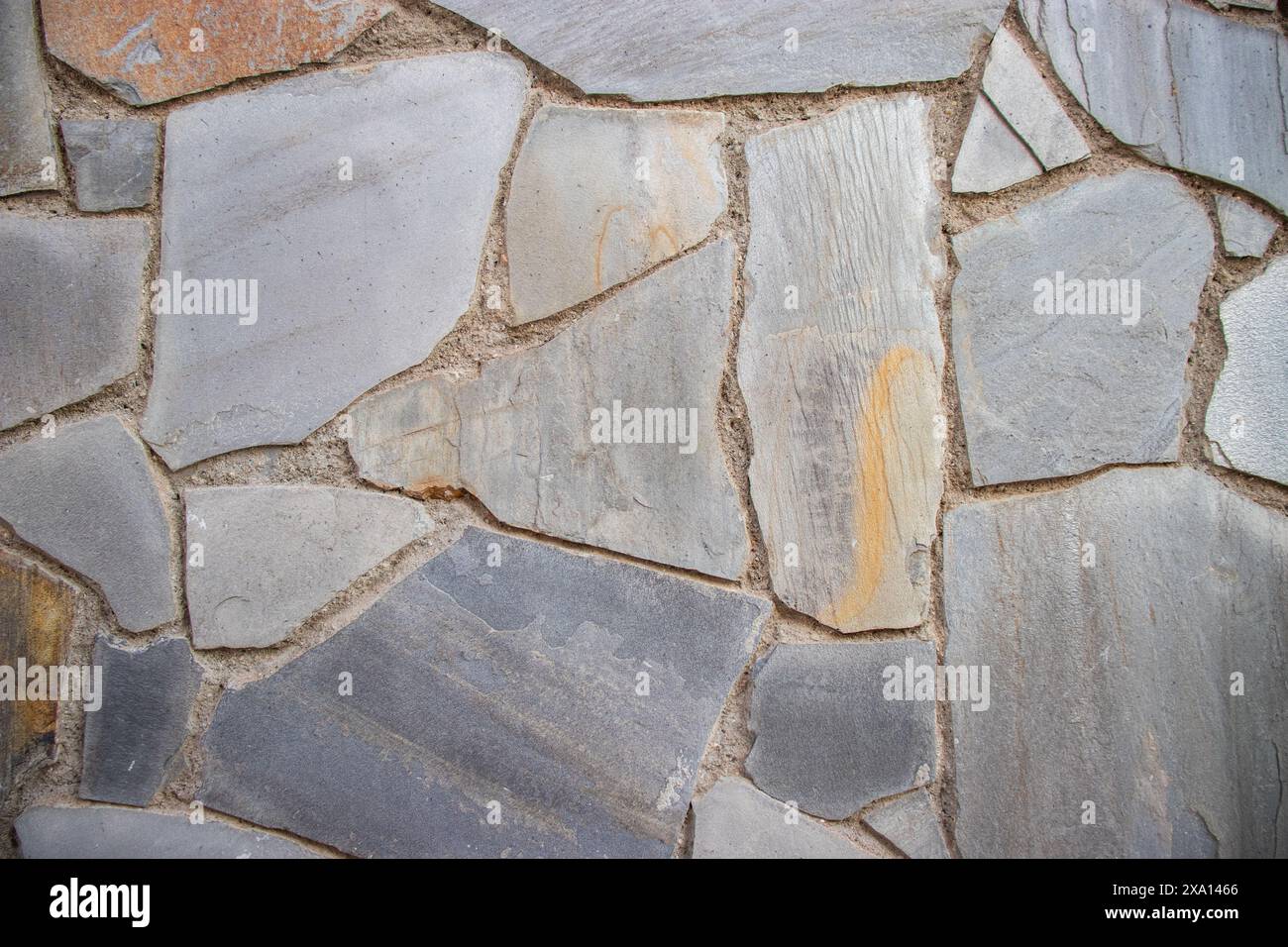 Close up Photograph of a Textured, Patterned wall on the facade of a historic buildung in El Papiol, Spain Stock Photo
