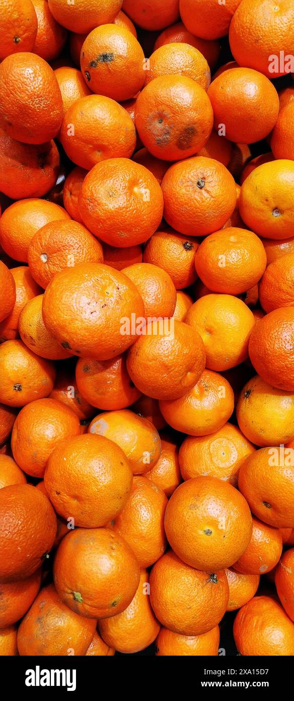 A pile of oranges on a table Stock Photo