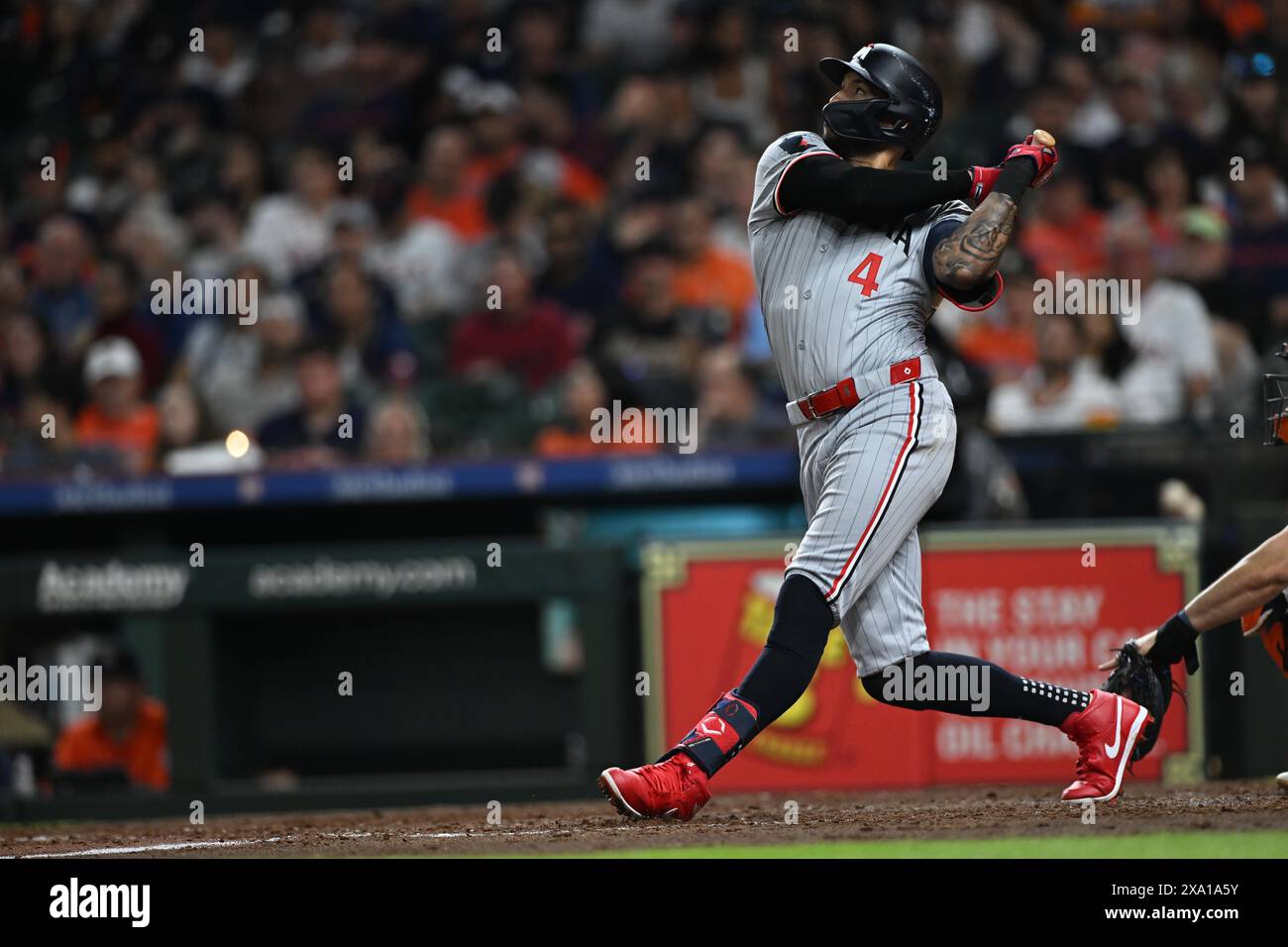 Minnesota Twins shortstop Carlos Correa (4) flies out to right in the