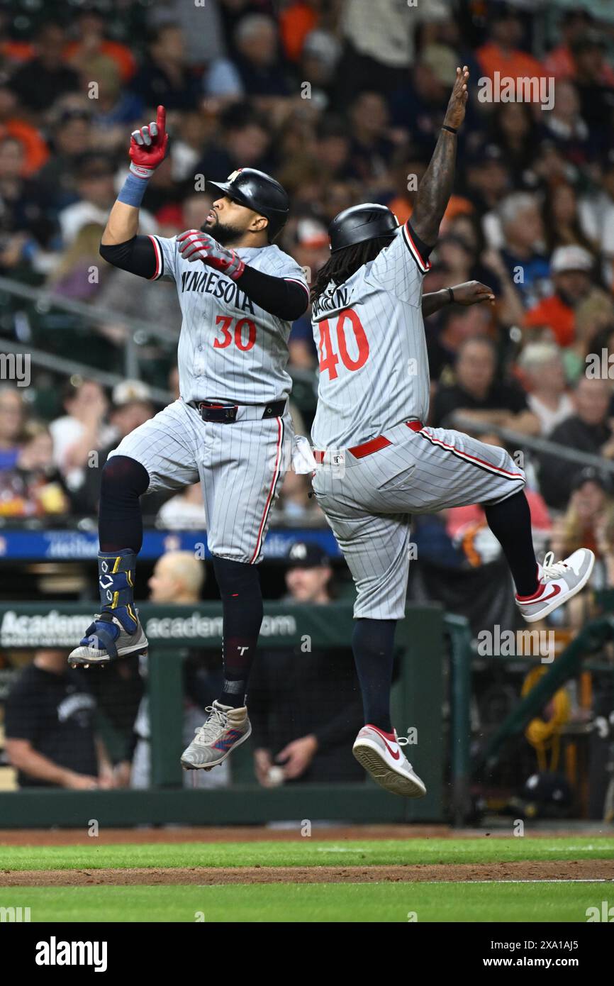 Minnesota Twins first base Carlos Santana (30) celebrates his solo home