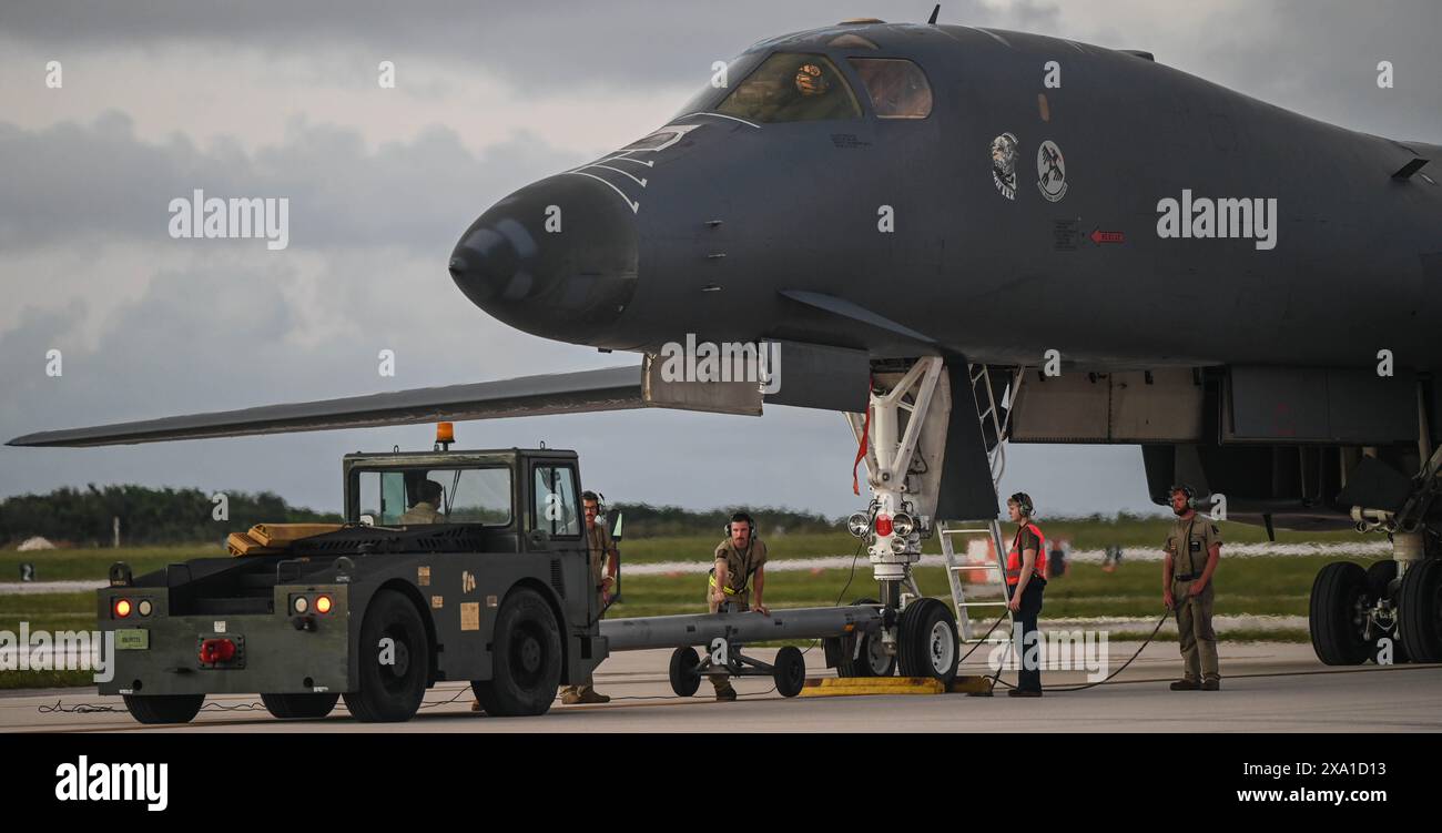 Yigo, United States. 29 May, 2024. U.S. Air Force Airmen assigned to the 28th Aircraft Maintenance Squadron prepare to tow a U.S. Air Force B-1B Lancer supersonic stealth strategic bomber aircraft, on the ramp at Andersen Air Force Base, May 29, 2024, in Yigo, Guam.  Credit: 2nd Lt. Alejandra Angarita/U.S. Air Force Photo/Alamy Live News Stock Photo