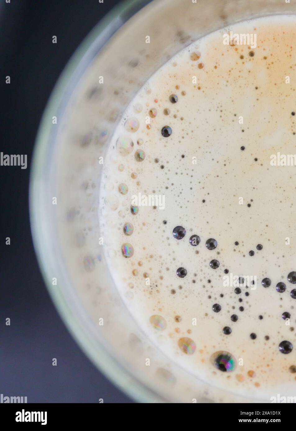 A closeup of freshly brewed coffee using a coffee machine in a glass Stock Photo