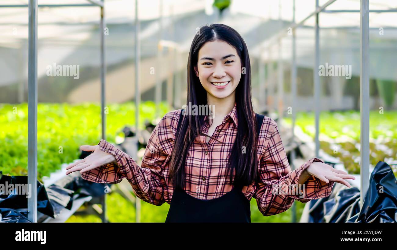 Woman working in greenhouse hi-res stock photography and images - Alamy