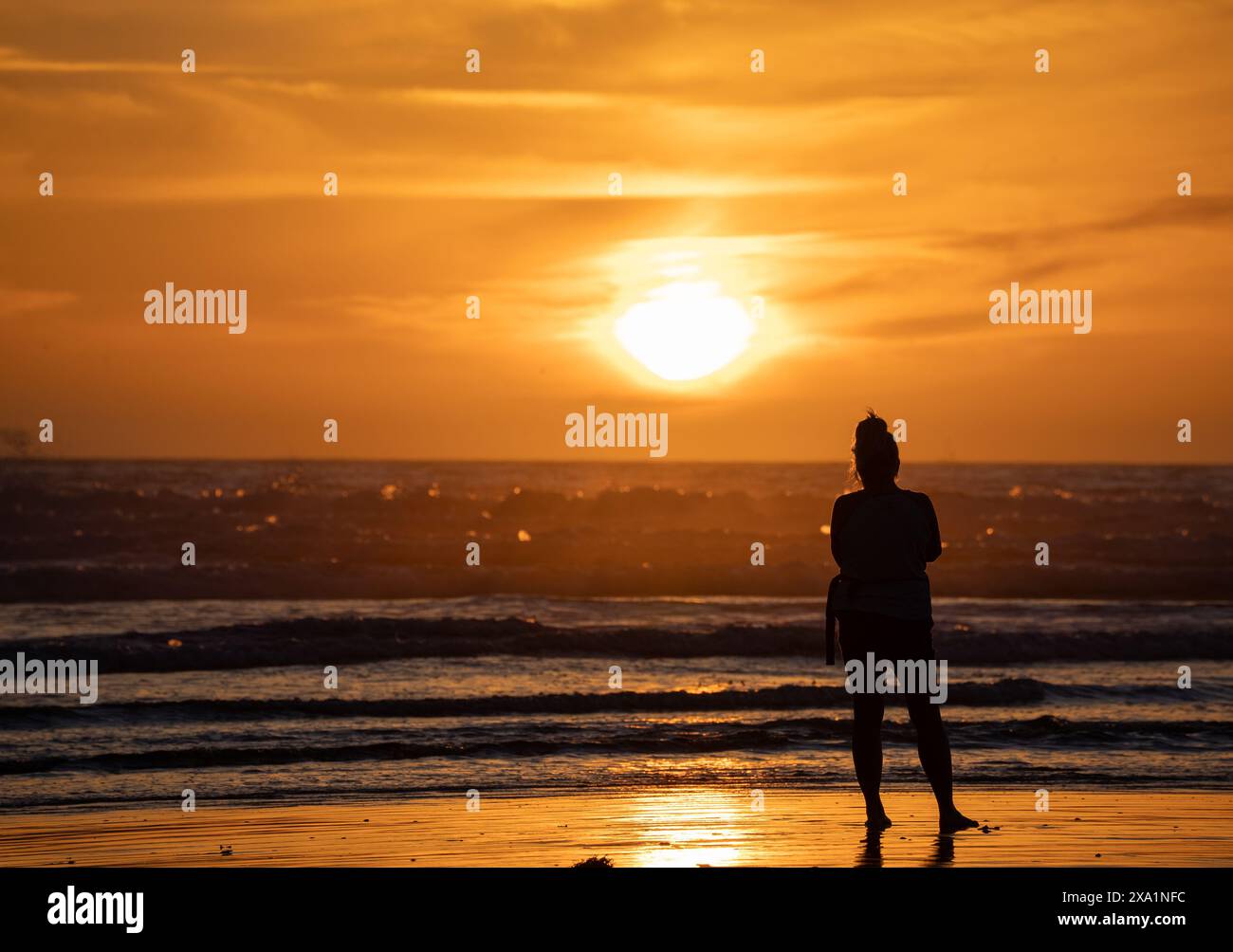 Woman on beach contemplative hi-res stock photography and images - Alamy