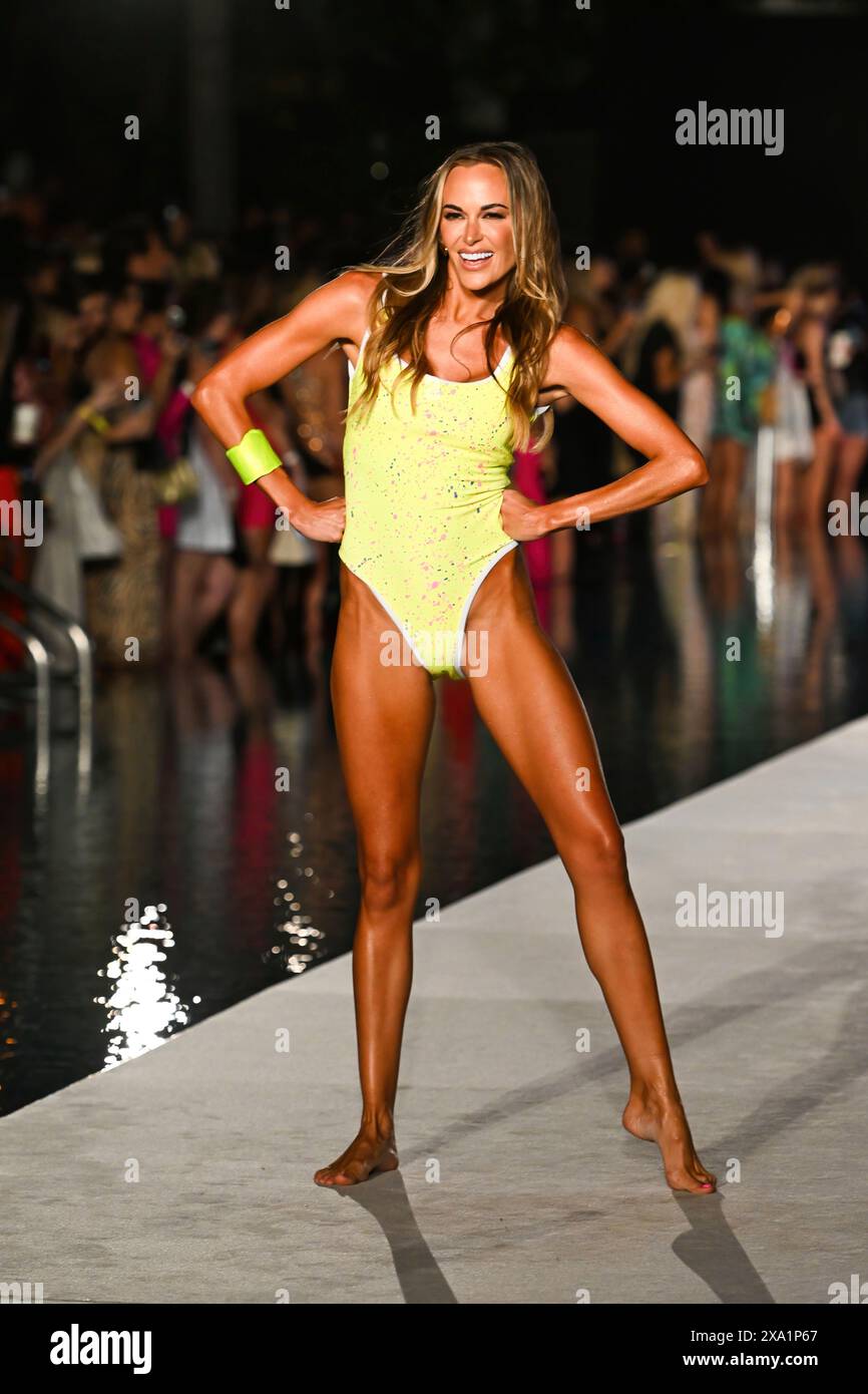 Model Jena Sims walks the runway during the Sports Illustrated swimsuit