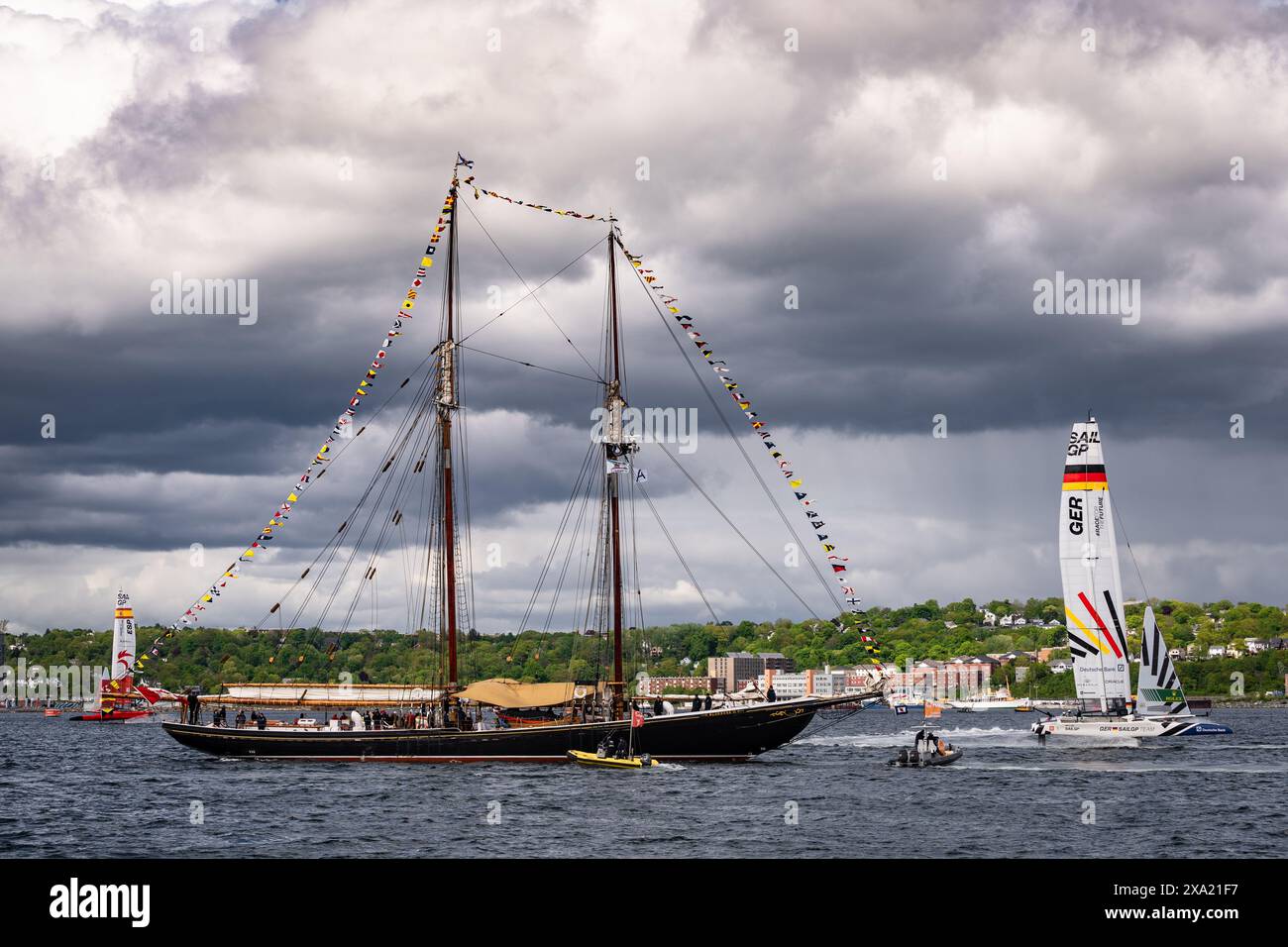 Teams from Germany and Spain race their boats around the schooner