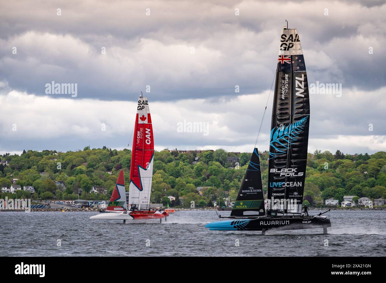 Boats from Team Canada and Team New Zealand racing during the June 2024 Sail GP event in Halifax