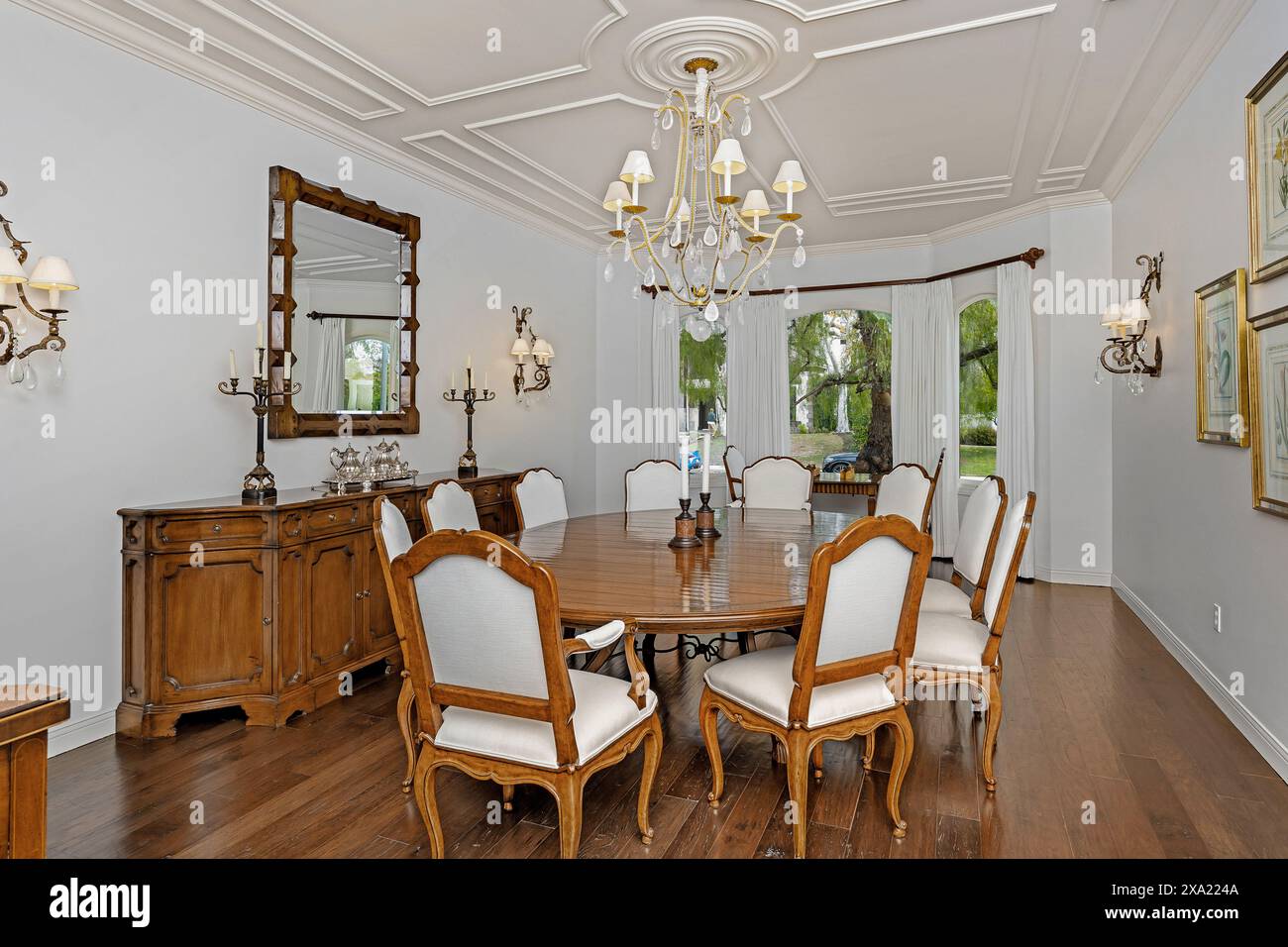 An elegant dining room with a round table and stylish dining area Stock Photo