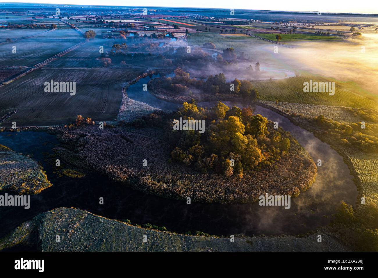 Aerial view of a field with water and farmland in the background Stock ...