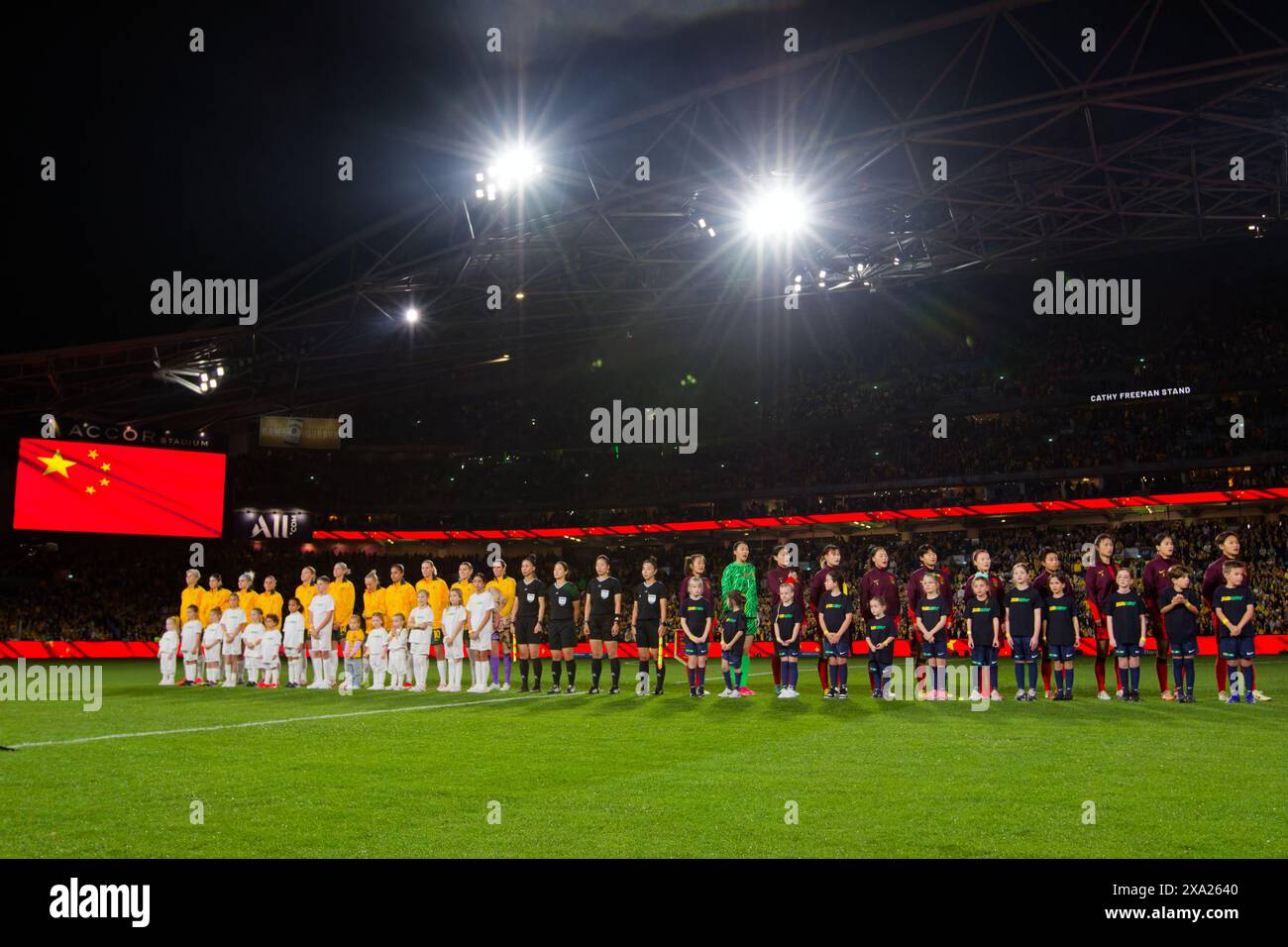 Sydney, Australia. 03rd June, 2024. Australia and China PR players line up for the National Anthem before the international friendly match between Australia and China PR at Accor Stadium on June 3, 2024 in Sydney, Australia Credit: IOIO IMAGES/Alamy Live News Stock Photo