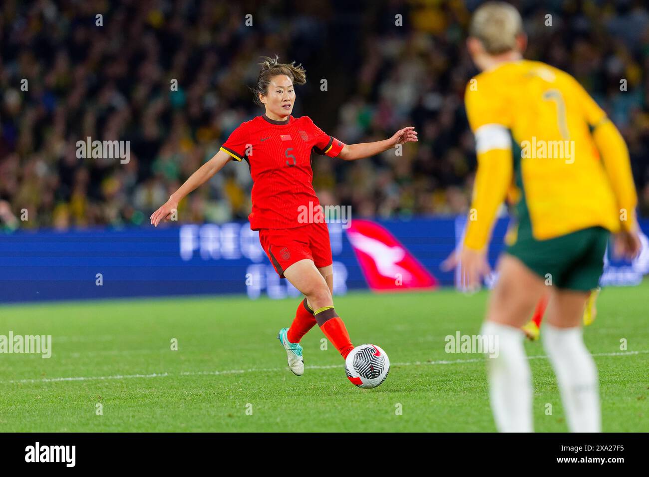 Haiyan Wu of China controls the ball during the international friendly ...