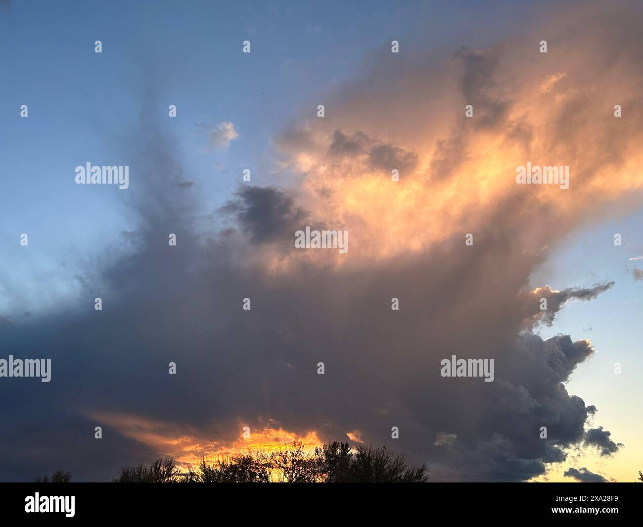 Dramatic storm clouds over a city skyline Stock Photo