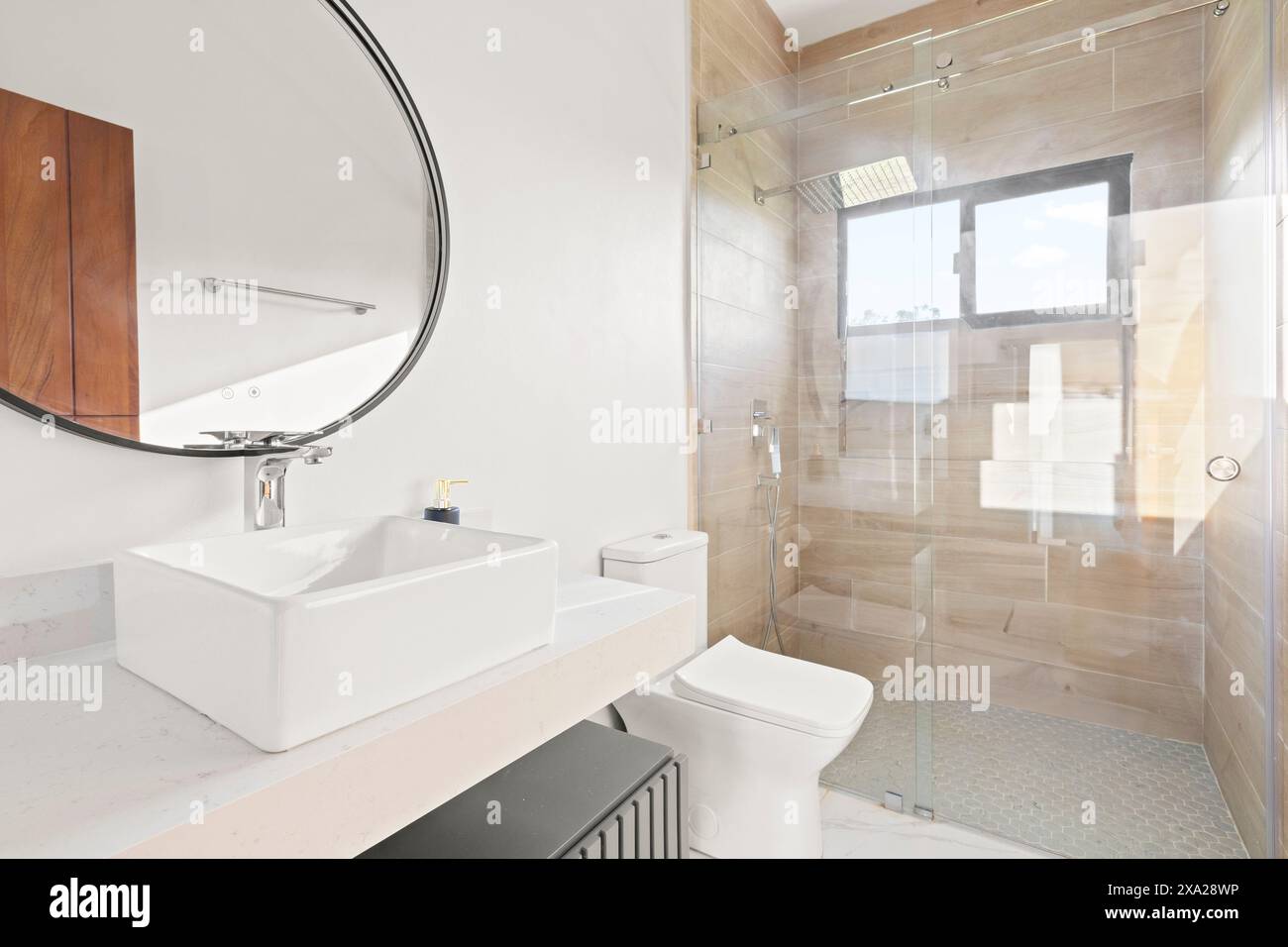 A luxury vacation home featuring toilet, sink, and glass shower enclosure Stock Photo - Alamy