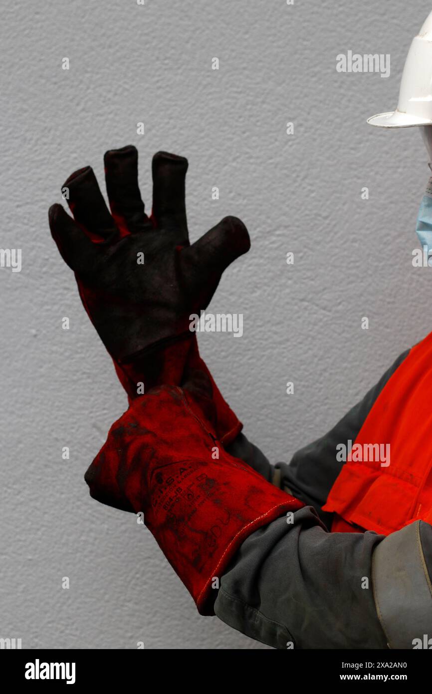 Fire proof gloves to handle dangerous substances Stock Photo