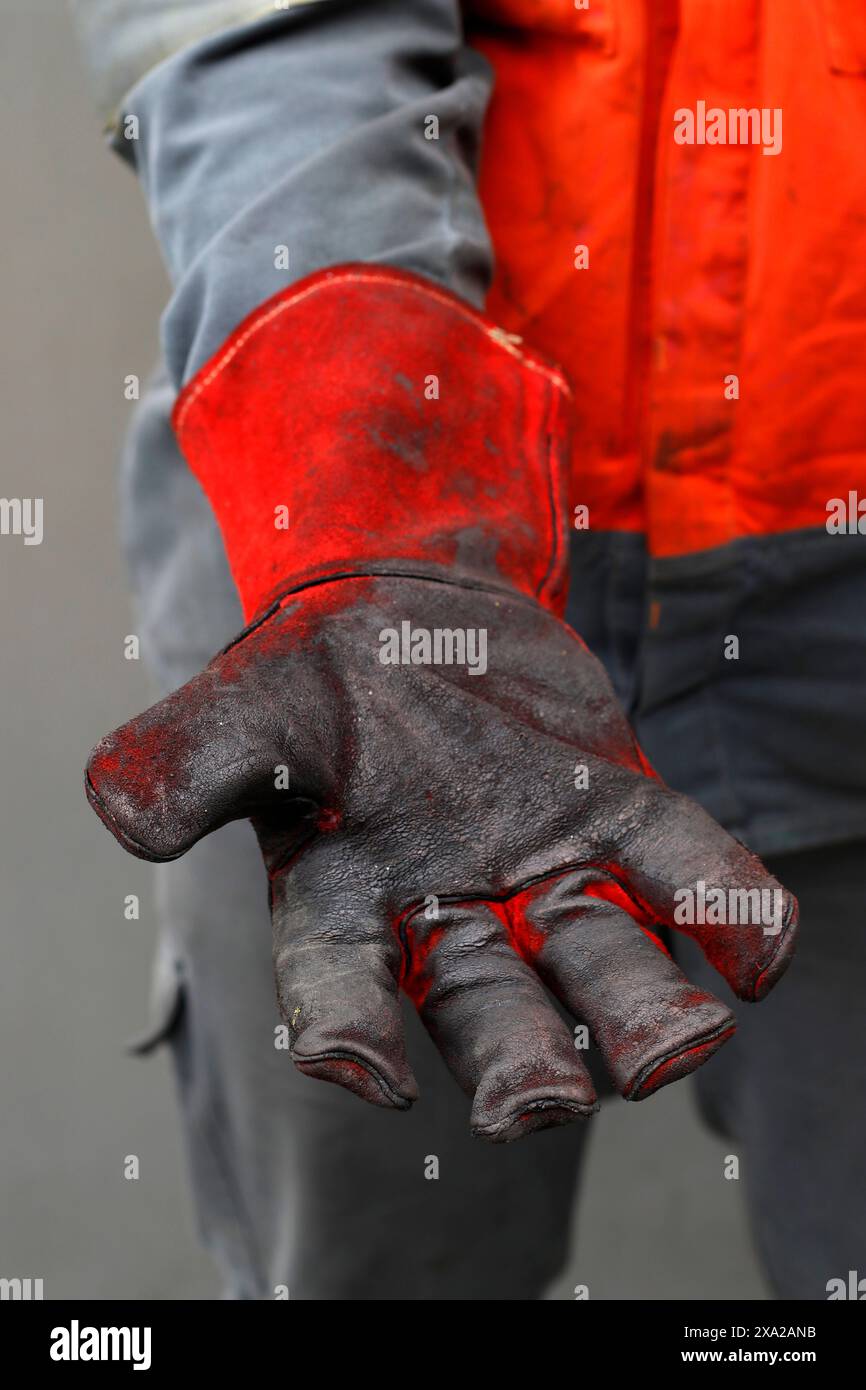 Fire proof gloves to handle dangerous substances Stock Photo