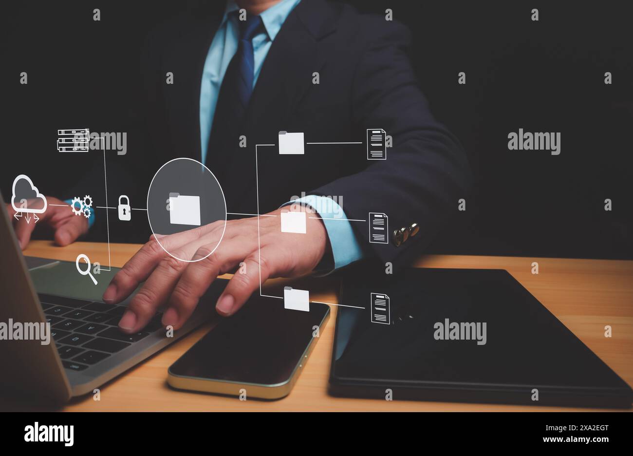 Businessman using a computer to document management, Document Management System (DMS) being setup by IT consultant working on laptop computer in offic Stock Photo