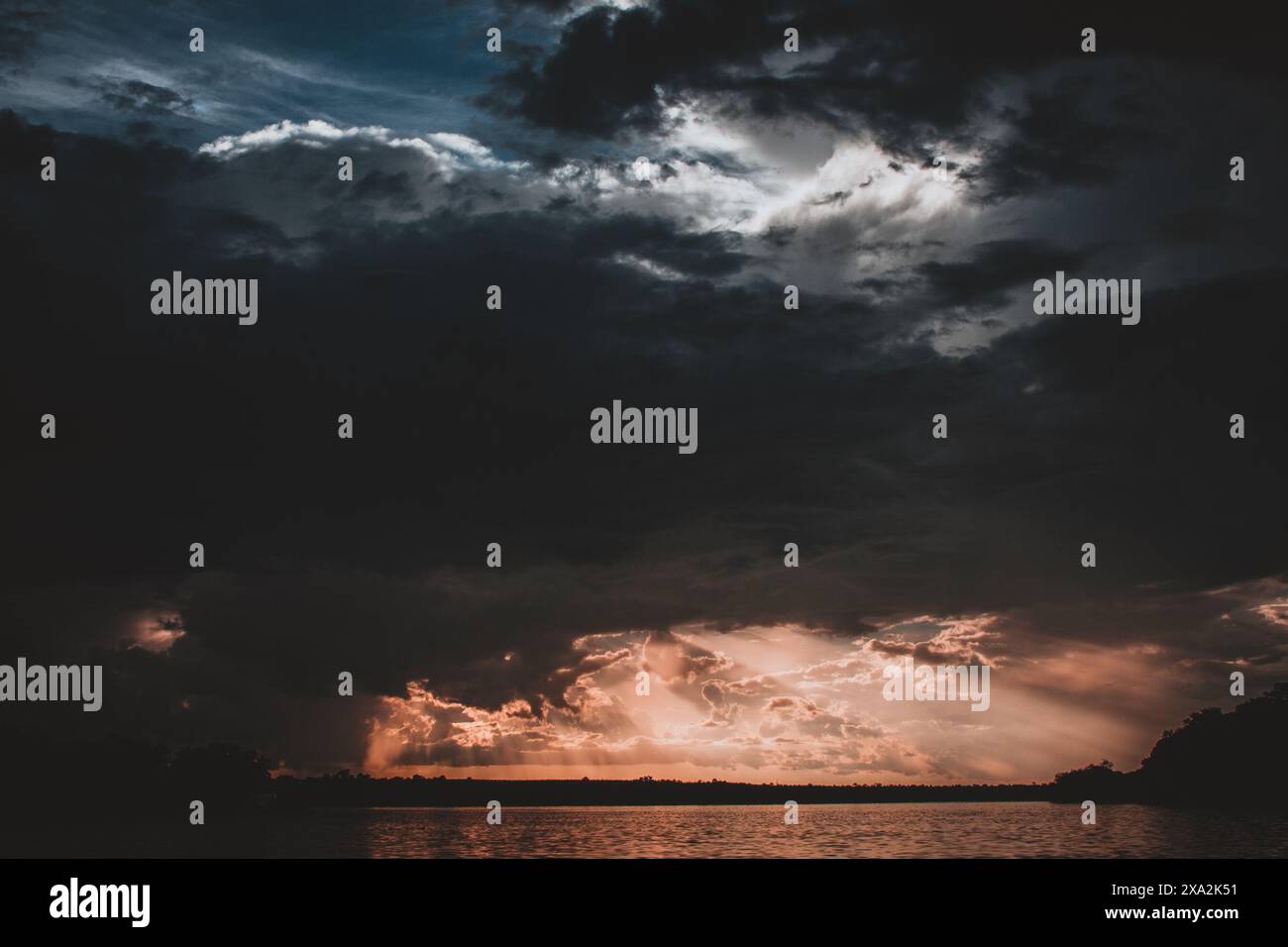 Intense Sun Rays A breathtaking capture of an epic sunset storm over the Zambezi River ...