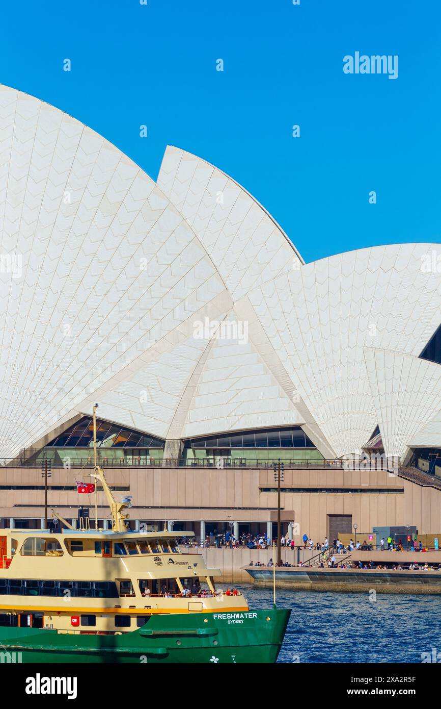 Architectural detail from Sydney Opera House on Sydney Harbour in Sydney, Australia. Pictured: Sydney Ferry 'Freshwater' in the foreground. Stock Photo