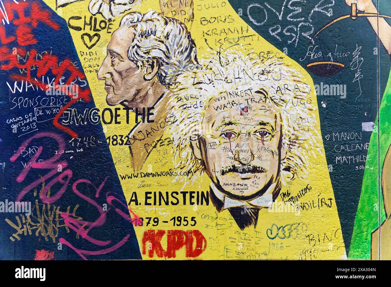 Portraits of Einstein and Goethe on a yellow wall, surrounded by graffiti, mural, East Side Gallery, Mauergalerie, Berlin, Germany Stock Photo