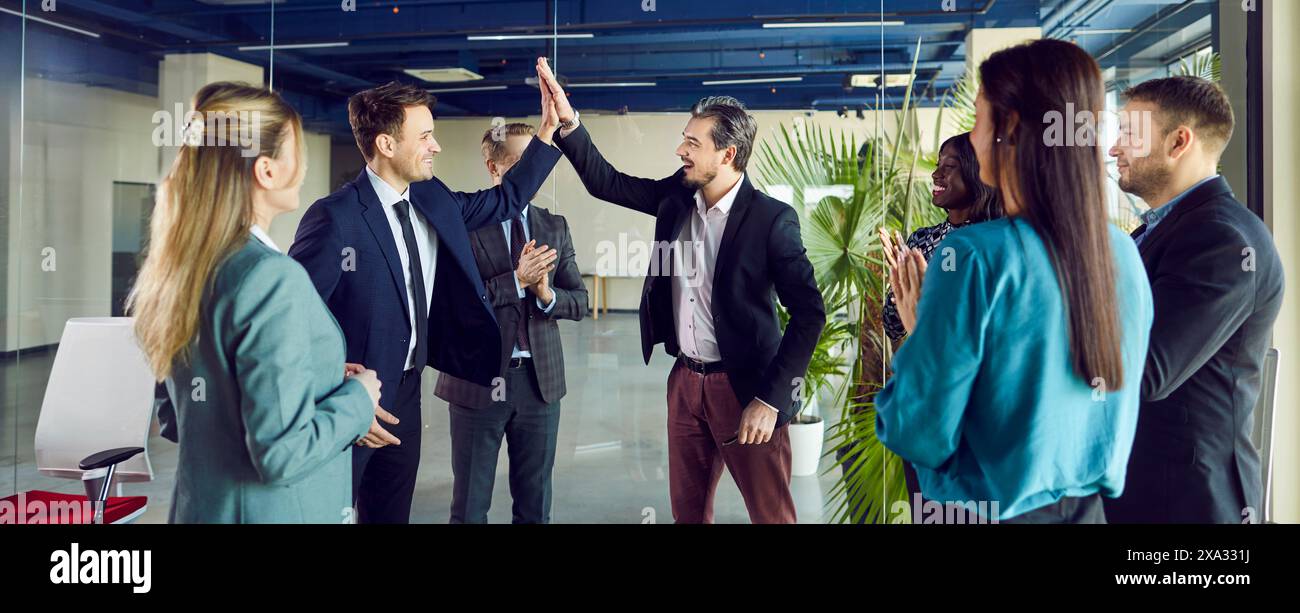 Business People Giving High Five And Celebrating Success In A Team ...