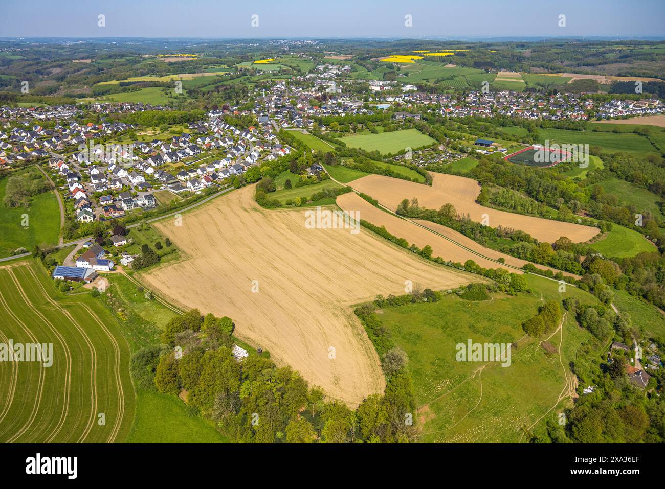 Aerial view, meadows and fields, cemetery and residential area ...