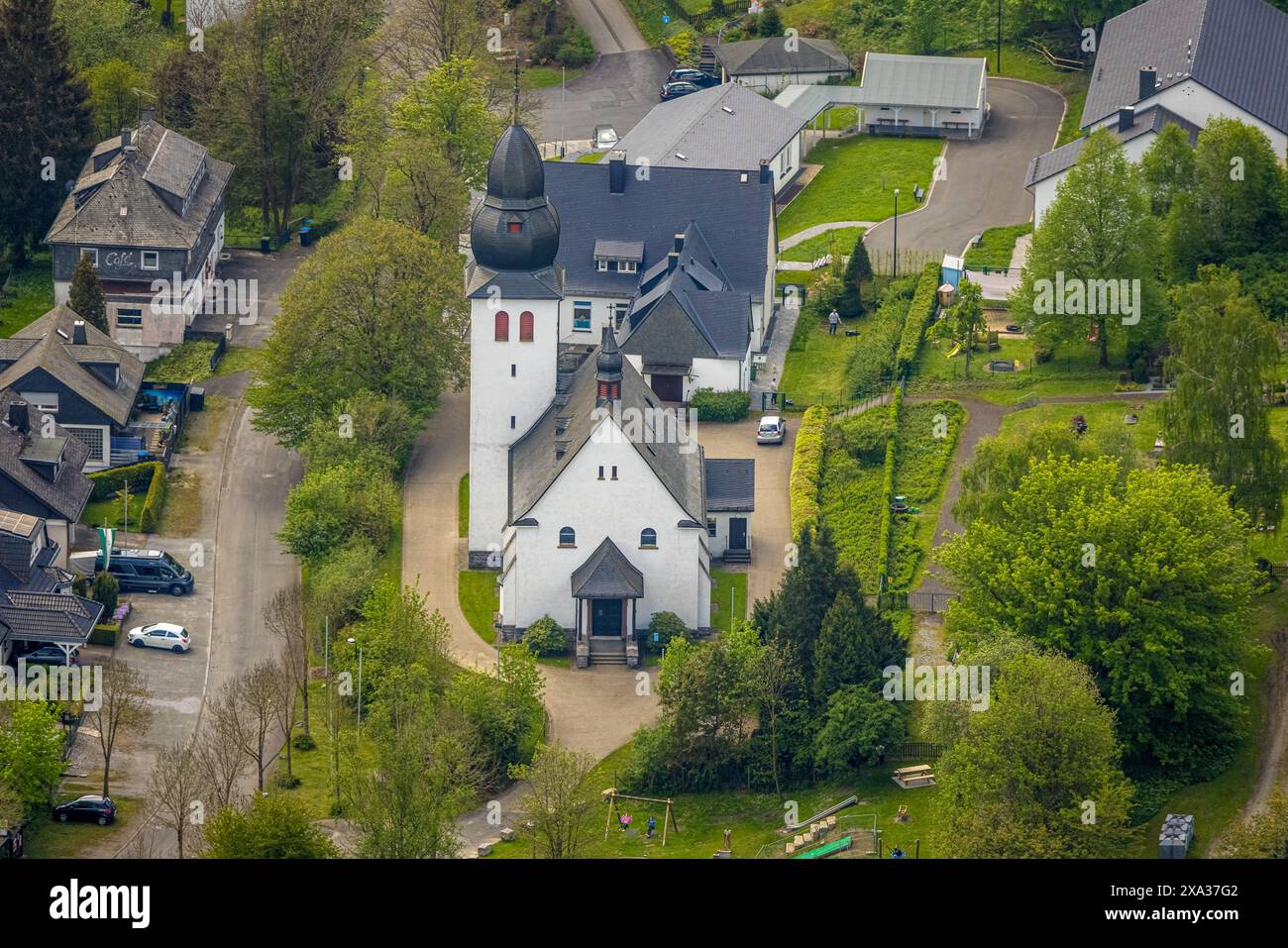 Aerial view, St. Joseph church and cemetery burial ground, Brilon-Wald