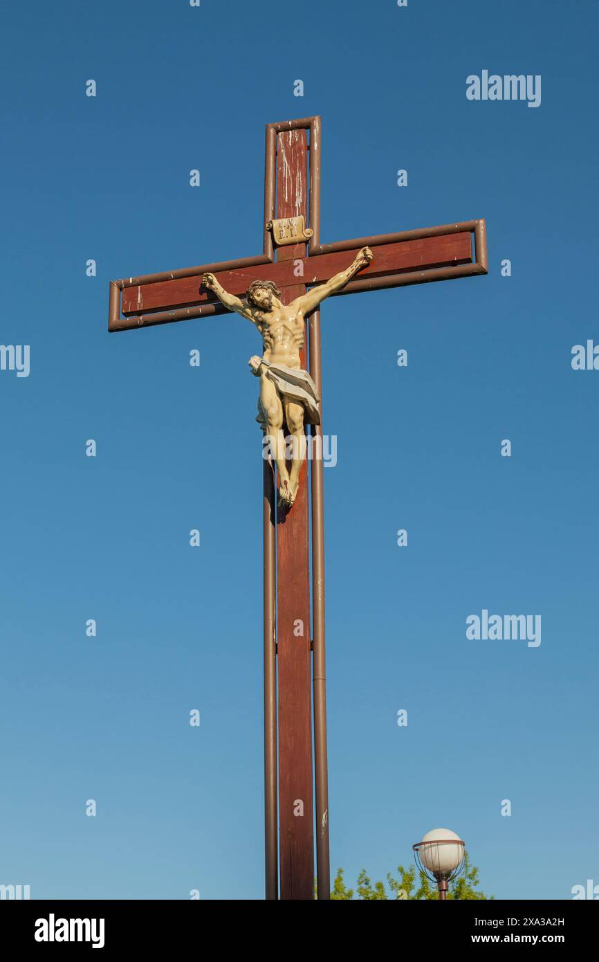 Cross with the crucifixion of Jesus Christ against the blue sky Stock ...