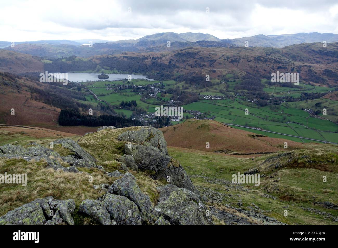 Grasmere Village & Grasmere Lake from the Crags on the Summit of the Wainwright 'Stone Arthur' in the Lake District National Park, Cumbria, England. Stock Photo