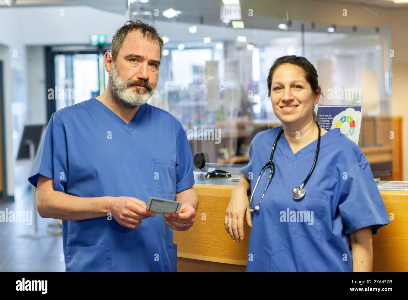 Medical professionals standing at the reception of a medical practice