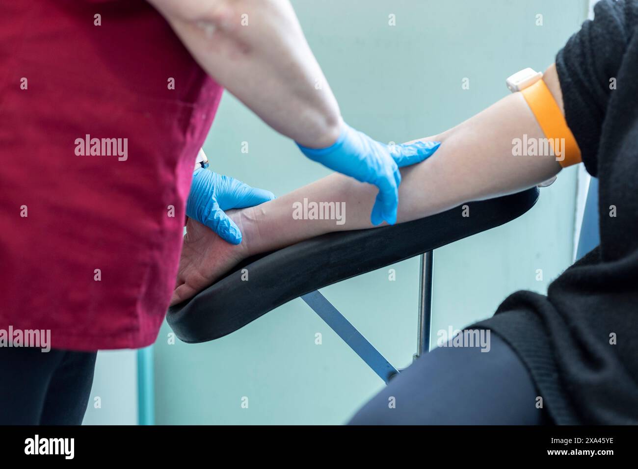 Blood drawn from arm for medical test Stock Photo