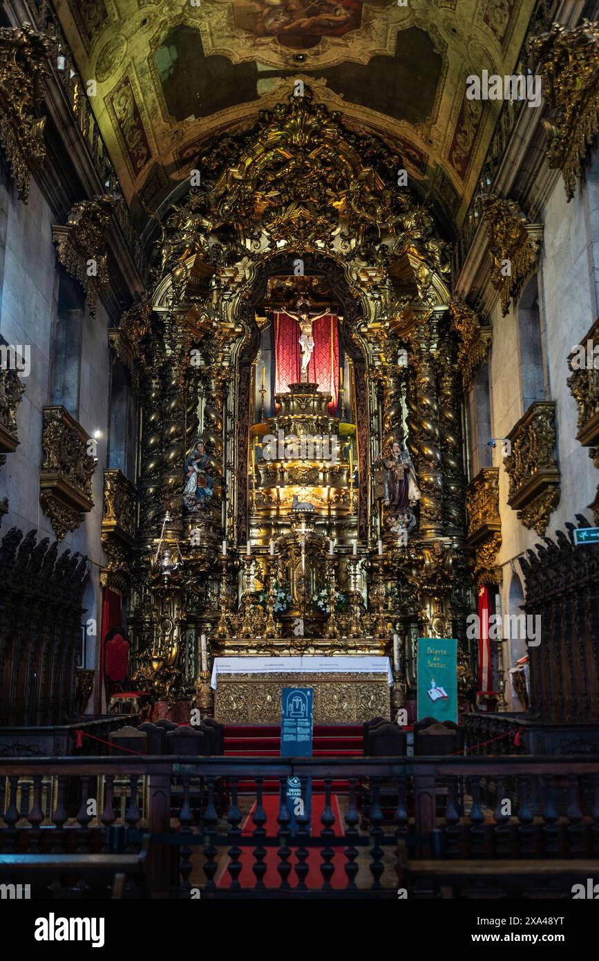 Altar with the crucifixion of Jesus Christ in the interior of the Church of Carmo in Oporto or Porto, Portugal Stock Photo